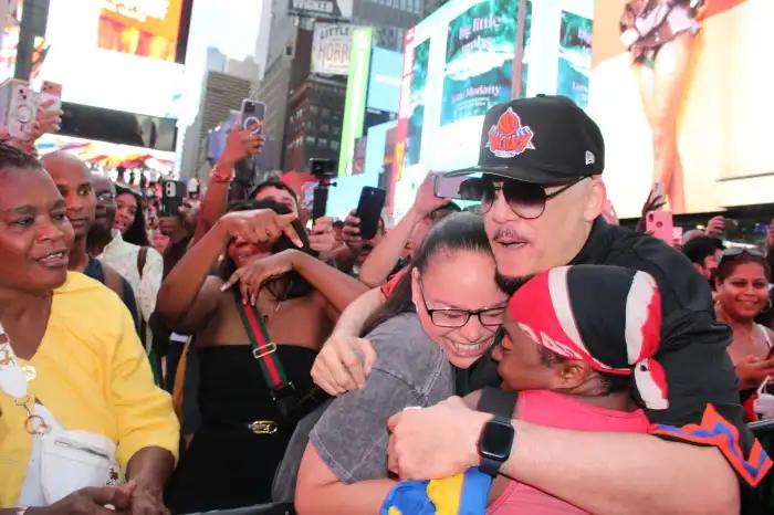 Rupee embraces fans in Times Square on Aug. 30.
