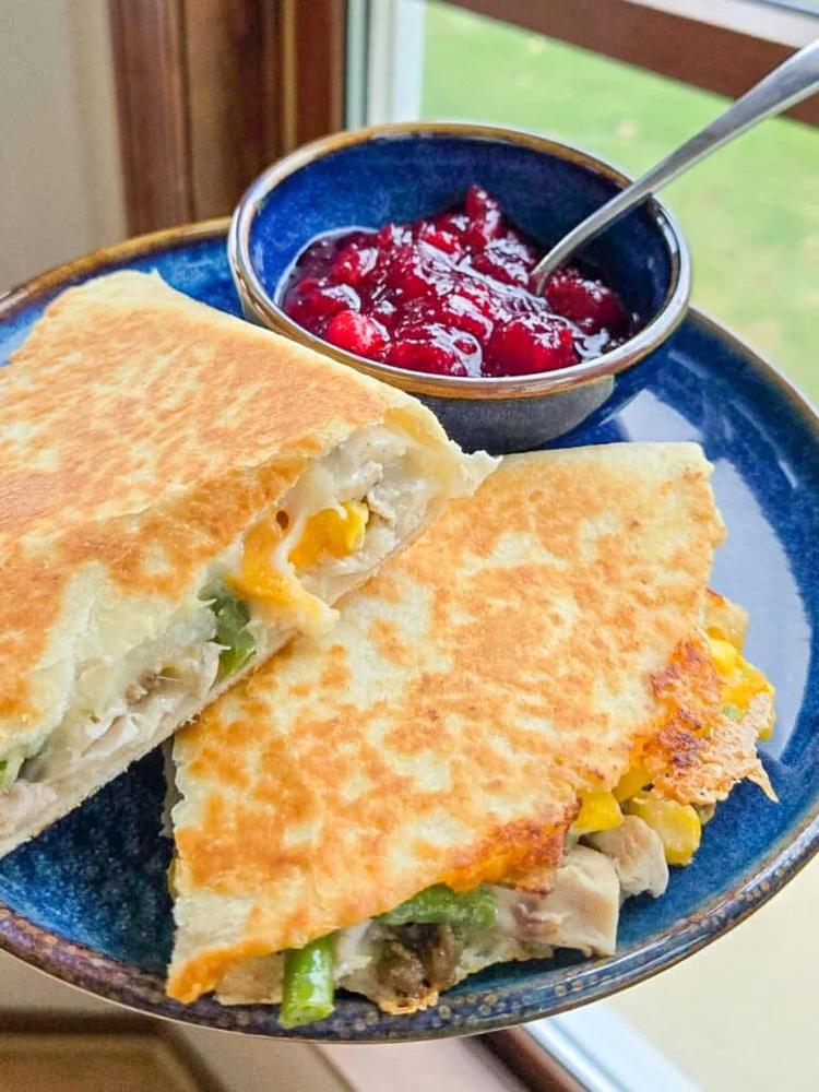 close up of quesadilla with all the thanksgiving dishes
