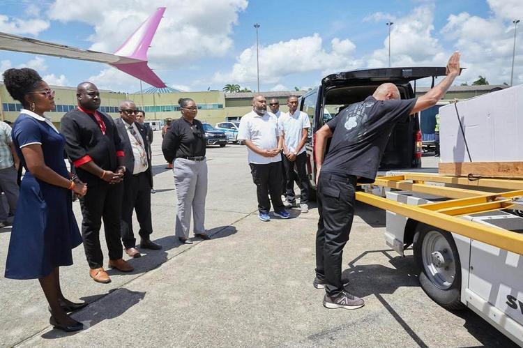 The body of The Mighty Sparrow is loaded into a hearse after arriving in Trinidad on Oct. 6, 2026. 