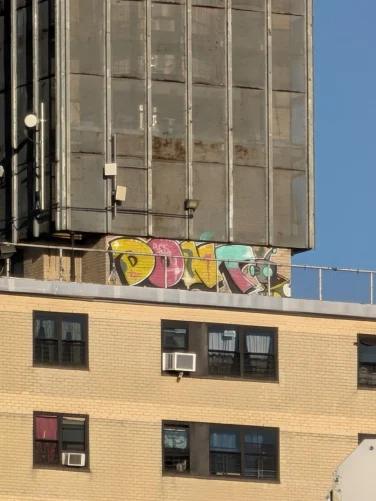 The same building with graffiti clearly visible at 30x zoom