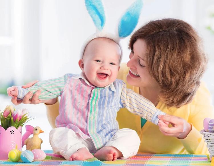 A mother enjoying her baby's first Easter celebration.