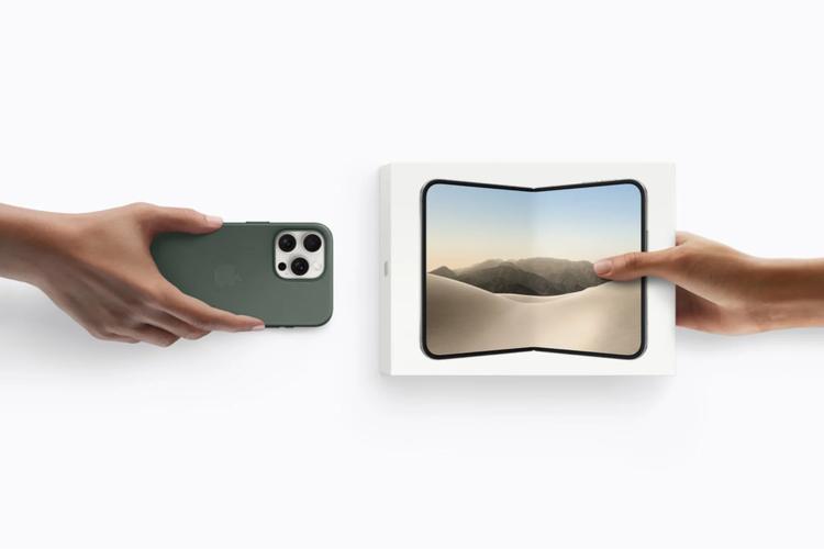 a person trading in an older iphone for an iphone duo