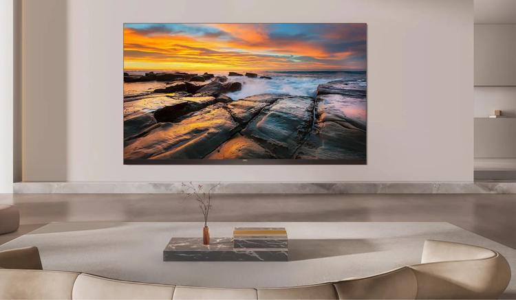 TCL X11L TV mounted on wall above marblecounter