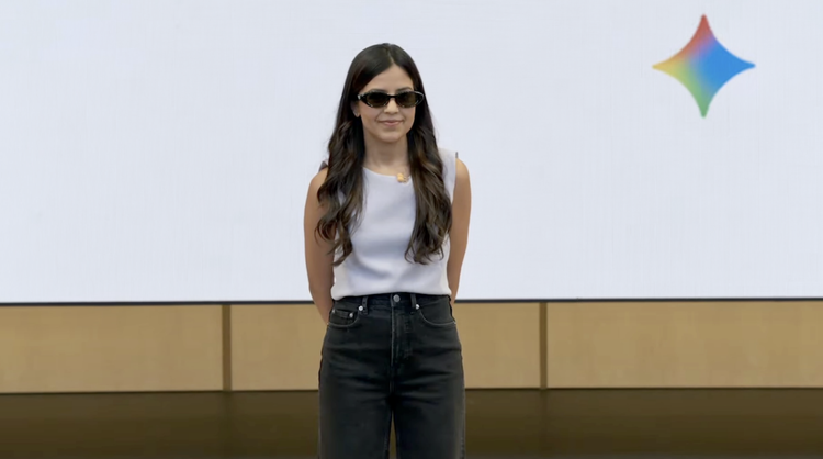 Woman wearing new Google glasses on stage