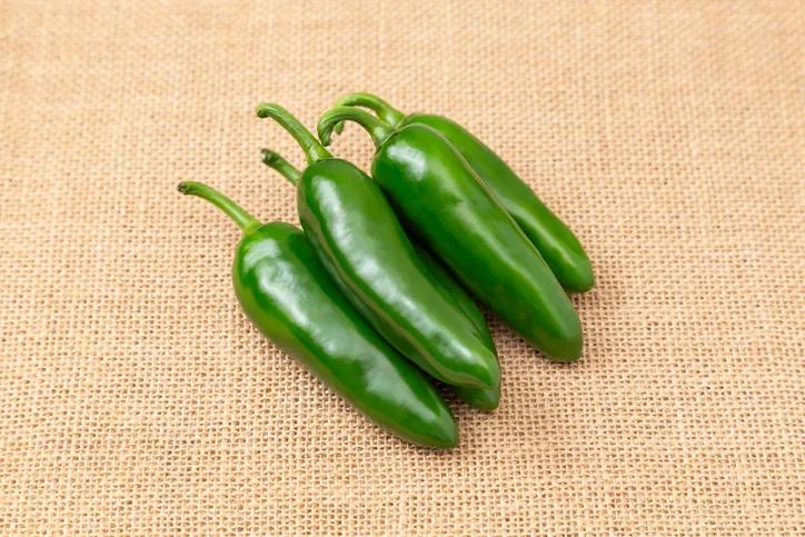 Jalapeños placed on a linen cloth