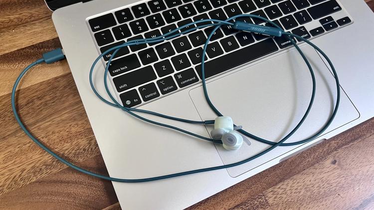 bose wired earbuds plugged into macbook