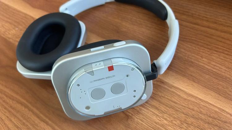 silver nothing headphone (1) on desk