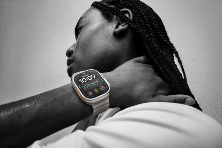 a man wearing the apple watch ultra 4