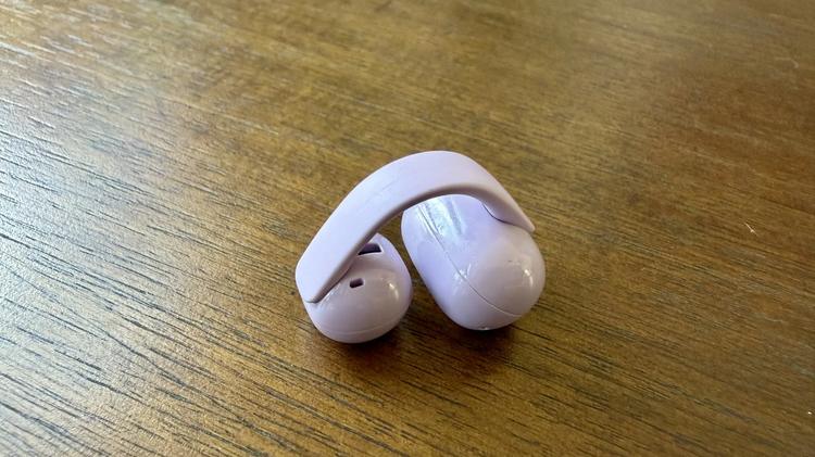 close up of purple sony linkbuds clip earbud on table