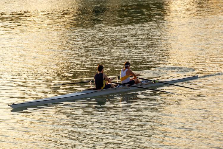 Men rowing on a boating lake 