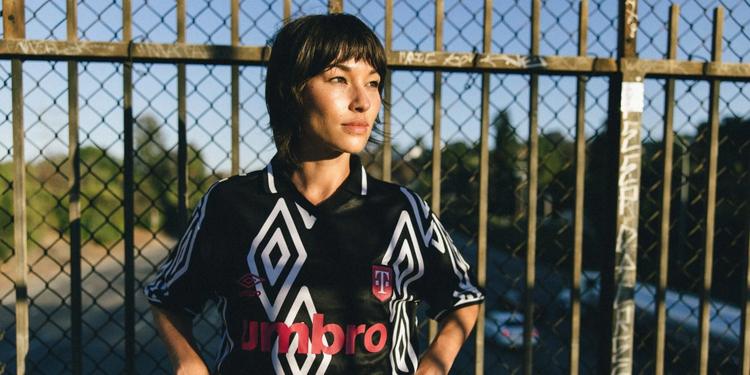 Umbro and T-Mobile jersey collab; three models wearing the jerseys.