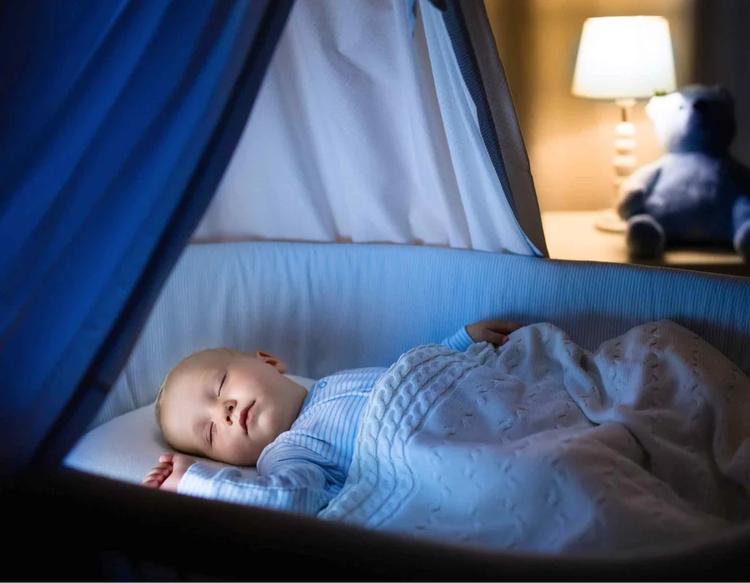 Baby boy sleeping peacefully in a calm and cozy nursery setup, featuring a safe sleep environment designed for infant comfort, restful nighttime sleep, and healthy baby sleep habits.