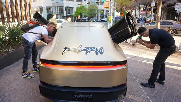The Cybercab shown at SXSW, with the word Robotaxi.