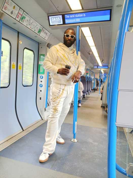Ras Emmanuel on a train in the UK.
