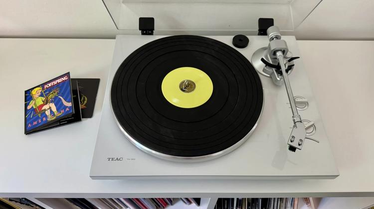 a tiny vinyl record on a standard turntable