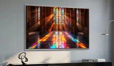 Samsung S95H TV mounted on wall above TV stand