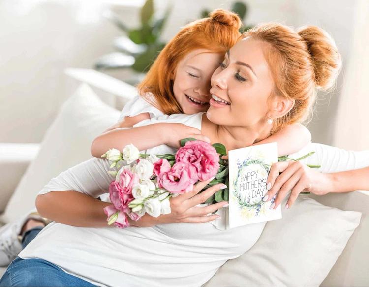 Girl greeting her mother with a warm hug on Mother’s Day, celebrating love and family bonding in a heartfelt moment.