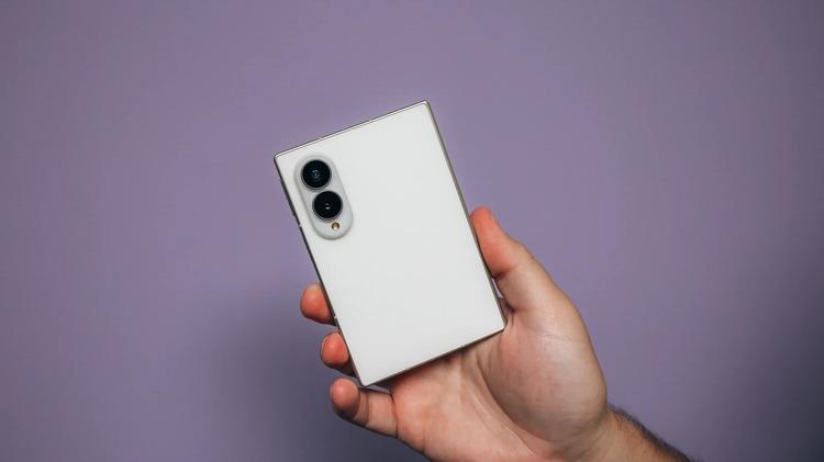 the galaxy z fold 8 held in hand