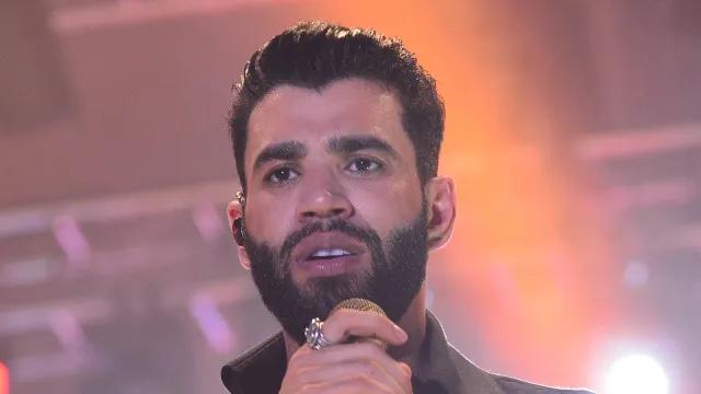 Gusttavo Lima terá de indenizar fã expulsa de show após 'fazer o L'