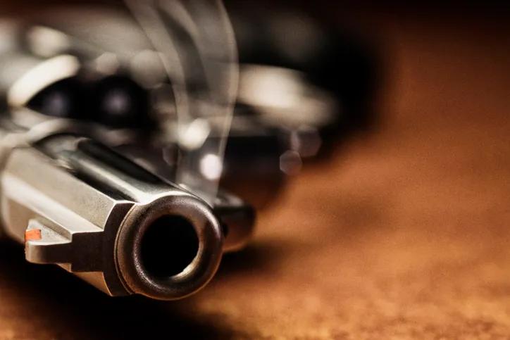 Smoking gun lying down on the floor