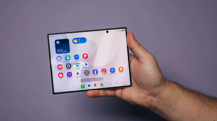 galaxy z fold 8 held in hand on home screen