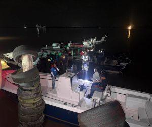 Guyana Opposition Leader Azruddin Mohamed, seen being held on his boat prior to his arrest, has been released on $100,000 bail after a disputed Demerara River confrontation involving Joint Services personnel.