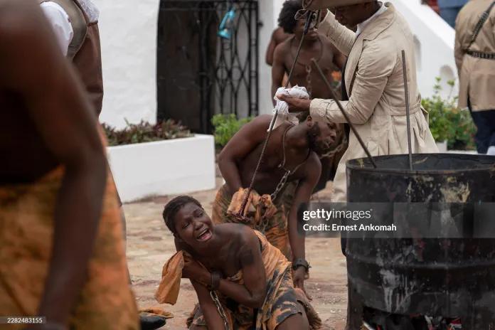 Performers reenact the branding of slaves at Christiansborg Castle in Ghana on June 19, 2026.