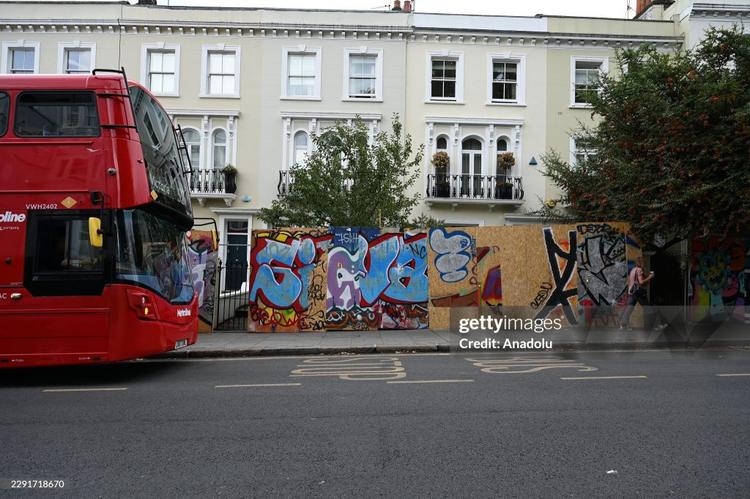 As Notting Hill Carnival marks its 60th anniversary, businesses are boarding up amid the festival's most extensive security operation yet.