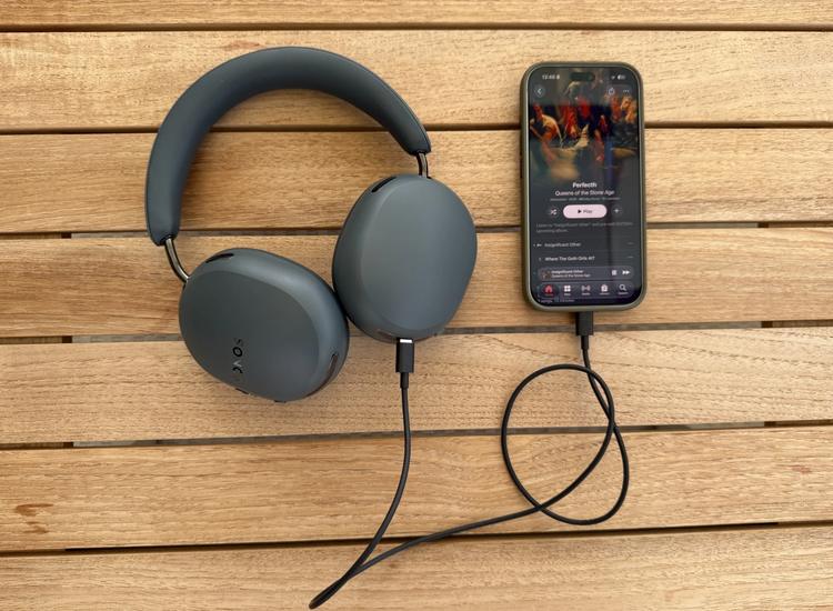 Sonos Ace Ultra headphones connected to smartphone with usb-c cable
