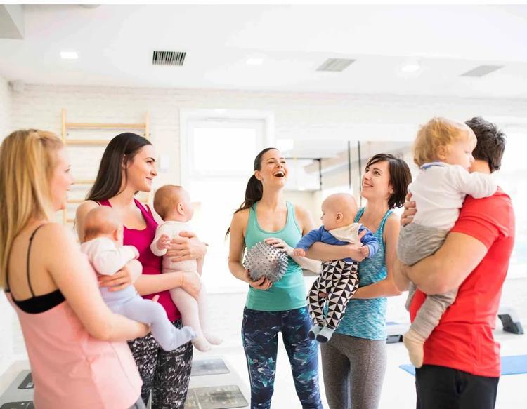 Mothers bonding with their babies while sharing parenting experiences and enjoying time together.
