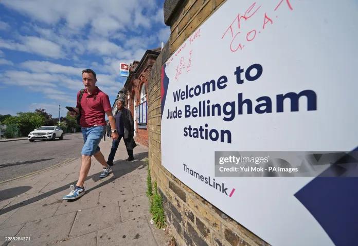 England Argentina - People walk past a sign outside Bellingham train station in south-east London, which has been renamed Jude Bellingham in honor of the England striker, during the 2026 World Cup. Picture date: Monday July 13, 2026.