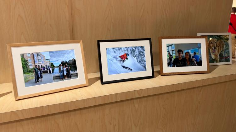 three Alexa Photo Frames sitting on a shelf