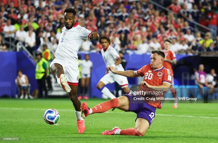 Scotland's Lawrence Shankland goes close under pressure from Haiti's Hannes Delcroix during a 2026 FIFA World Cup Group C match between Haiti and Scotland at the Boston Stadium, on June 13, 2026, in Foxborough, United States