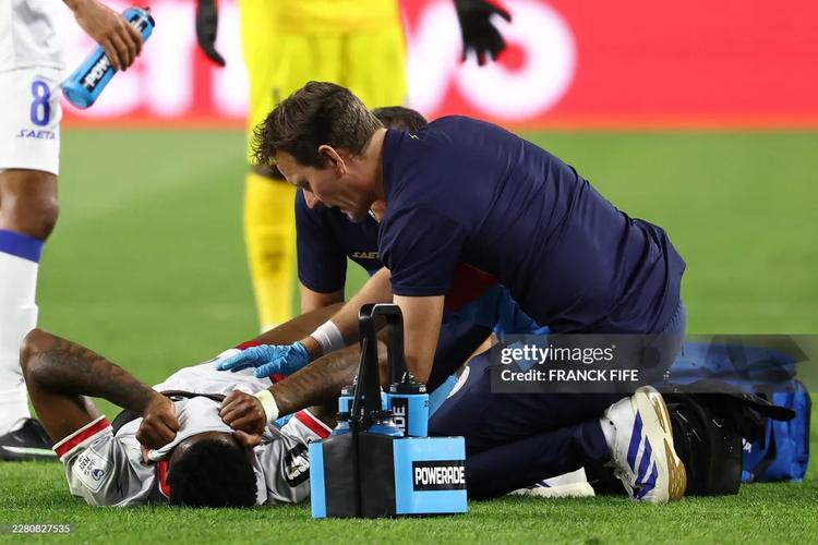 Haiti's forward #21 Josue Casimir receives medical attention during the 2026 World Cup Group C football match between Haiti and Scotland at the Boston Stadium in Foxborough on June 13, 2026.