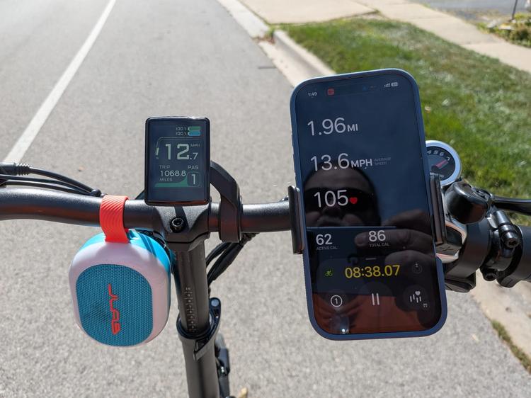 bike with phone clipped onto handle bars with apple fitness app open