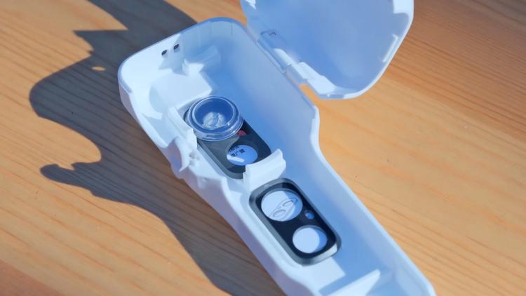 The Insta360's protective case, showing storagefor the black mist filger and wide-angle lens.