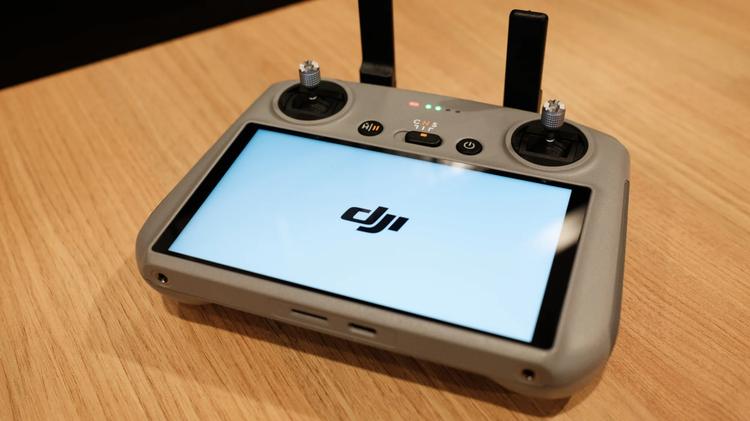 DJI RC 2 remote controller resting on a table.