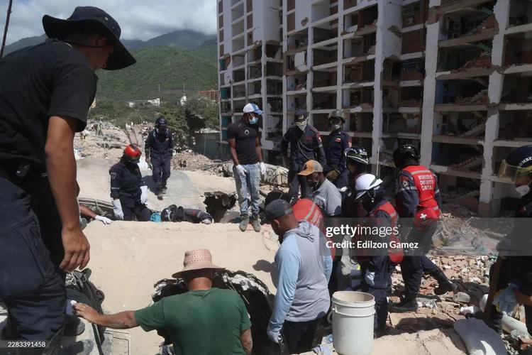 Work continues to remove the debris as part of the search and rescue efforts at the collapsed residential building Rita in the San Bernardino neighborhood after a magnitude 7.2 earthquake struck Venezuela and other regions in the Caribbean on June 29, 2026 in Caracas, Venezuela. 