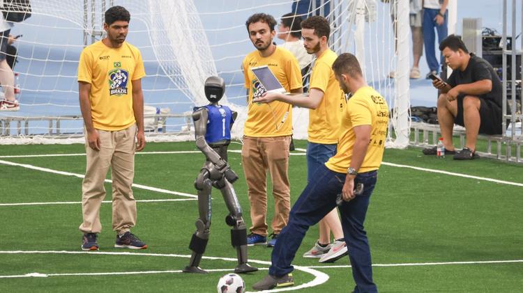 A humanoid robot undergoes testing with the guidance of engineers during preparations for the upcoming Second World Humanoid Robot Games at the National Speed Skating Oval on August 19, 2026 in Beijing, China.