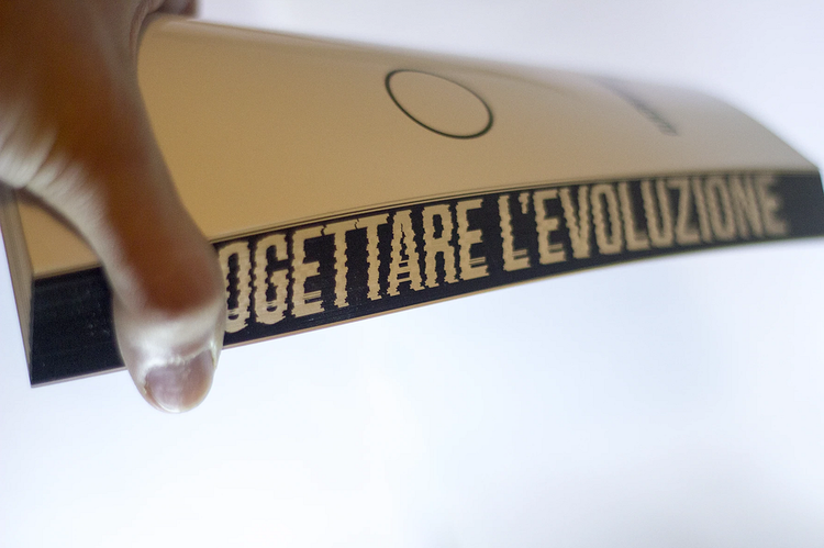 A close-up of a physical copy of my thesis called “Progettare l’evoluzione”