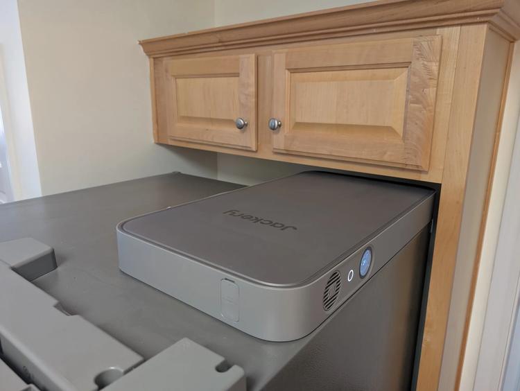 the jackery fridgepower on top of a refrigerator