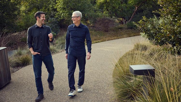 apple ceos tim cook and john ternus walk at apple park