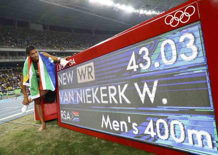 2016 Rio Olympics - Athletics - Final - Men's 400m Final - Olympic Stadium - Rio de Janeiro, Brazil - 14/08/2016. Wayde van Niekerk (RSA) of South Africa celebrates after winning the gold. REUTERS/Kai Pfaffenbach.
