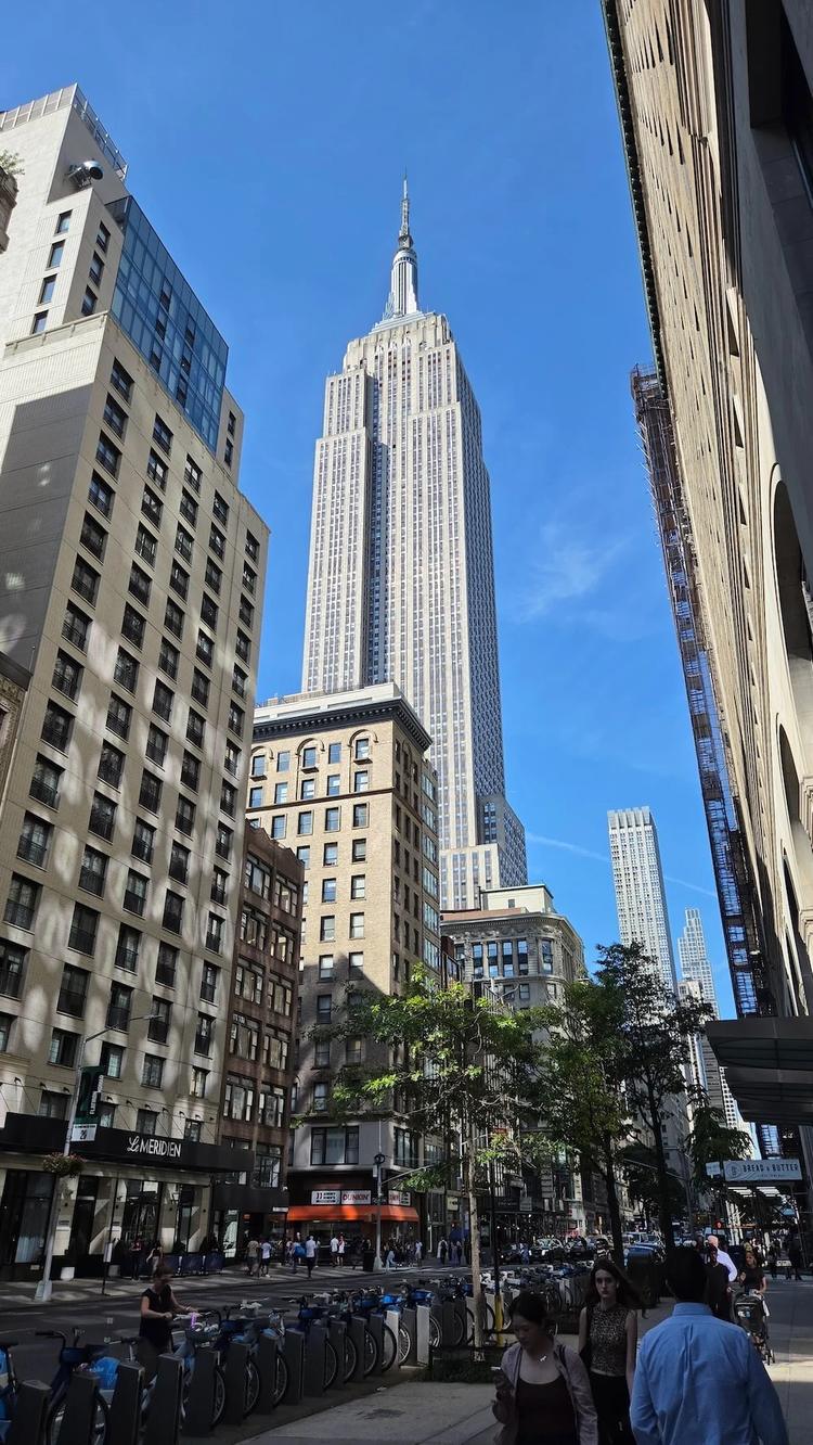 empire state building seen from the street in new york city