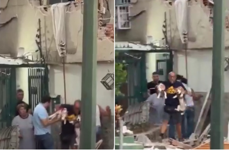 Caracas, uomo scappa dalla casa in macerie con i suoi due cani in braccio durante il sisma