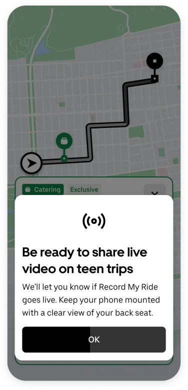 A screenshot of the Uber app. A pop up notification reads 
