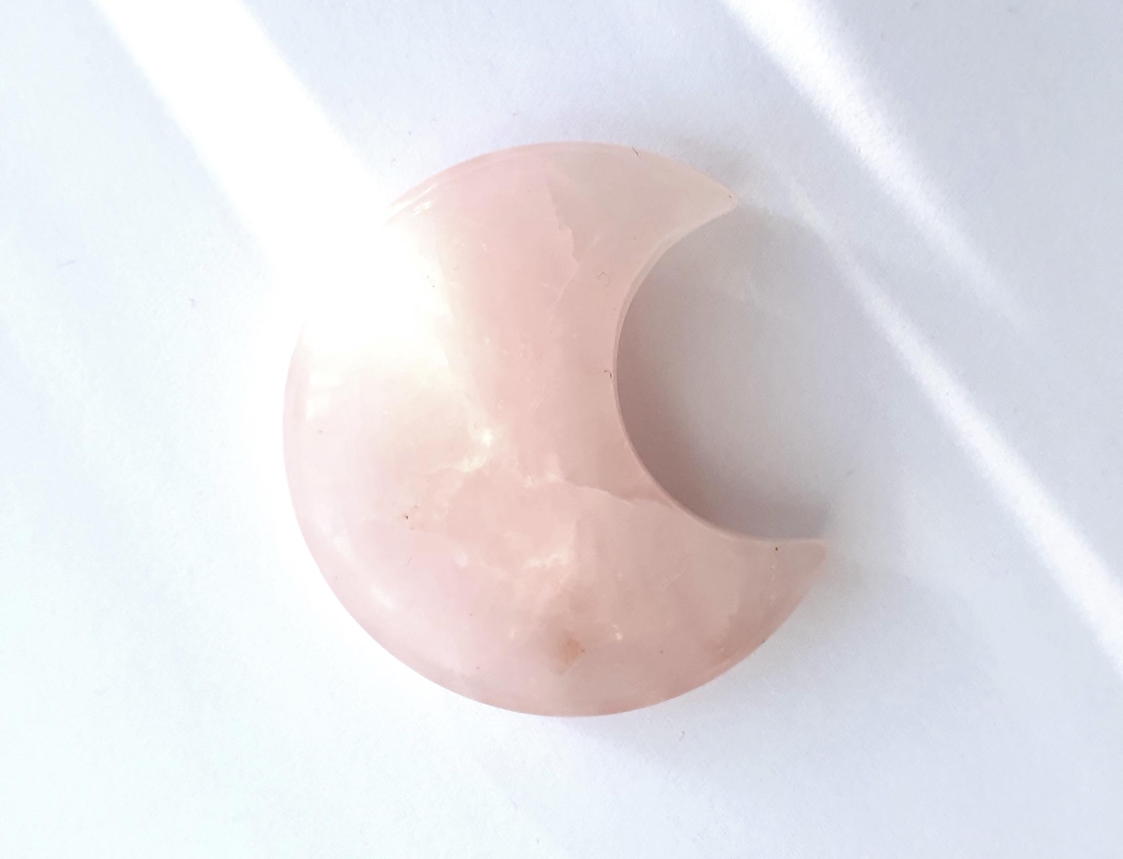 Rose quartz crystal for connecting to your intuition at the new moon in Pisces