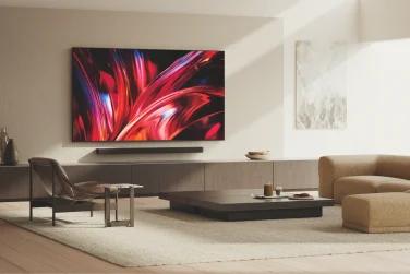 Sony Bravia 7 II TV mounted above sound bar on wall in living room