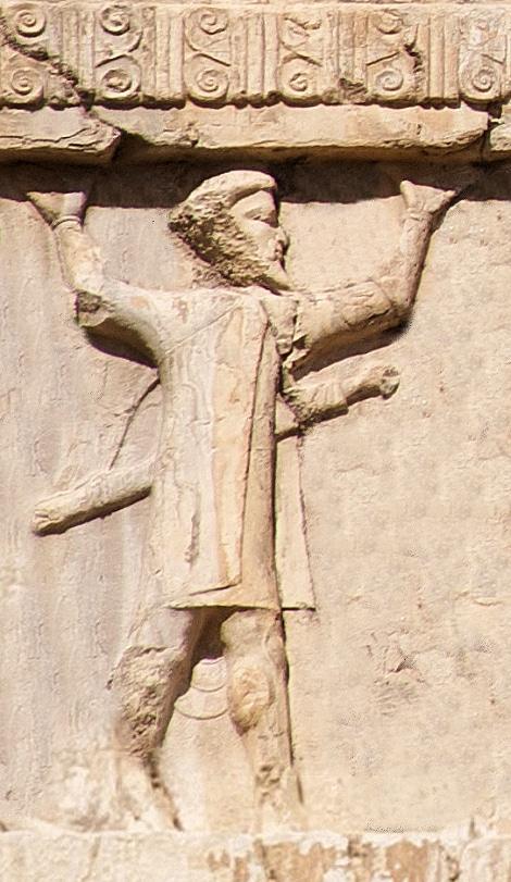 Ionian soldier (Old Persian cuneiform 𐎹𐎢𐎴, Yaunā)[1] of the Achaemenid army, circa 480 BCE. Xerxes I tomb relief