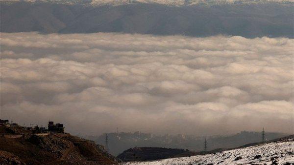 أجواء مغبرة تتحول إلى أمطار وضباب